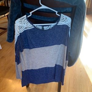 Blue and tan long sleeve shirt with lacy shoulders.